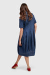 Alembika Denim Cocoon Dress.  Denim dress with full button placket and foldover collar.  3/4 sleeves   Pouf skirt. 2 side pockets.  Slim fit._t_60102108610926