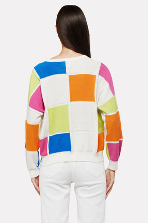 WISPR by Brodie Bianca Crew Sweater. Bright blocks of glue, orange, pink, lime and white. Textural knit using different stitches on blocks and outline. Crew neck, long sleeve sweater with drop shoulder. Rib trim at neck, hem and cuff. Relaxed fit. Shorter length._35061401813192