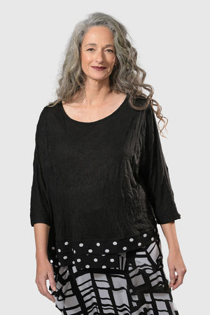 Alembika Dots Crinkle Top in Black.  Scoop neck top with 3/4 sleeve.  Crinkled knit with woven black and white dot double layer insert at hem.  Relaxed fit._34211554230472