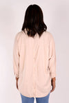 Suzy D Bonny Button Back Top in pale Pink. Pointed collar split v shirt with center seam. Dolman 3/4 sleeve with button cuff. Soft side gathers. Back yoke with button detail down center back. High low hem. Slightly oversized fit._t_34236644589768