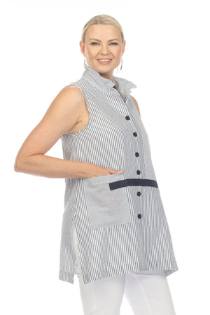 Terra Sleeveless Seersucker Vest in Navy with White stripes. Vertical stripe body. Wire collar button down sleeveless top with navy buttons and navy grosgrain detail on front. Single front horizontal stripe patch pocket. Deep side slits. Relaxed fit._35043837968584