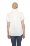 Terra Toggle Short Sleeve Blouse in White. Convertible collar button down blouse with short sleeves. Cinchable elastic sleeve hem with toggle detail. Adjustable side ruching with toggle. Curved hem. Relaxed fit._t_35044896506056