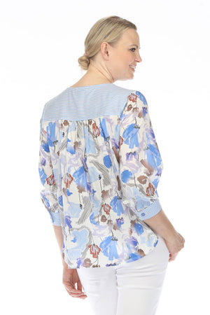 Terra V neck Floral Top in Blue.  Abstract floral print in blue multi on a cream background.  Crew neck with notched v in front.  Blue and white panels at shoulder and back yoke.  3/4 sleeve with striped button cuff.  Side seam pockets.  Relaxed fit._60026466632046