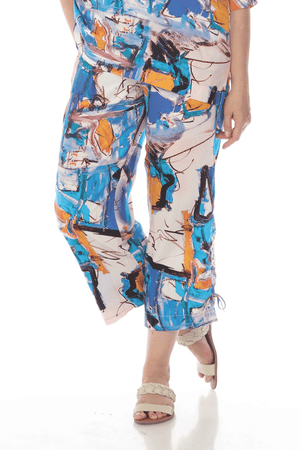 Terra Abstract Art Ankle Pant.  Shades of blue and orange abstract watercolor print.  Elastic waistband pull on pant with front slash pockets.  Straight leg with cinch ties at outside lower leg.  Side slits. Inseam: 26 1/2"_59705873924462