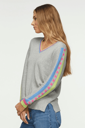 Zaket & Plover Jacquard Sleeve Sweater in Marled Gray. V neck sweater with long sleeves. Color block stripe and block print on center sleeve. Striped trim at neck and cuff. Ribbed at neck, cuff and hem. Side slits. Relaxed fit._34536815919304