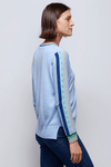 Zaket & Plover Jacquard Sleeve Sweater in Sky blue. V neck sweater with long sleeves. Color block stripe and block print on center sleeve. Striped trim at neck and cuff. Ribbed at neck, cuff and hem. Side slits. Relaxed fit._t_34536815886536