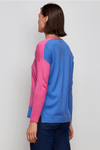 Zaket & Plover Two Tone Sweater in Bright Pink. V neck drop shoulder sweater. Color blocked with bright blue front to back. Single blue sleeve. Blue inset at left hem. Side slits. Rib trim at cuff and back hem. Rolled edge at neckline and front hem. Relaxed fit._t_34536885551304