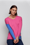 Zaket & Plover Two Tone Sweater in Bright Pink. V neck drop shoulder sweater. Color blocked with bright blue front to back. Single blue sleeve. Blue inset at left hem. Side slits. Rib trim at cuff and back hem. Rolled edge at neckline and front hem. Relaxed fit._t_34536885518536