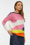 Zaket & Plover Wave Sweater in Denim. Denim blue, pink, white, yellow and orange wave color block construction in front. Vertical color block of pink and white in back. Boat neck dolman long sleeve knit with rib cuffs and hem. Side slits. Relaxed fit._t_34808968347848