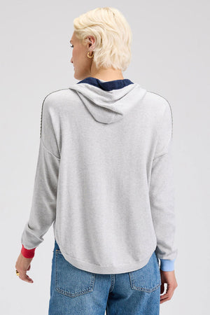 Zaket & Plover Joey Pocket Hoodie in Marled.  Heather gray pullover cotton/cashmere hoodie with contrast trim on hood and striped drawstring.  Long sleeves with contrast colored ribbed cuffs.  Front pouch pocket.  Blanket stitch trim at shoulders and pocket opening.  Curved hem with ribbing.  Relaxed fit._61025051935086
