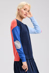 Zaket & Plover Elbow Intarsia Sweater in Denim.  Denim front, light blue left sleeve, bright blue right sleeve and coral back.  Contrast color intarsia elbow patches.  Crew neck long sleeve sweater.  Rib trim at neck, hem and cuff.  Side slits.  Relaxed fit._t_61200483451246