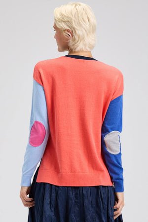 Zaket & Plover Elbow Intarsia Sweater in Denim.  Denim front, light blue left sleeve, bright blue right sleeve and coral back.  Contrast color intarsia elbow patches.  Crew neck long sleeve sweater.  Rib trim at neck, hem and cuff.  Side slits.  Relaxed fit._61200483484014