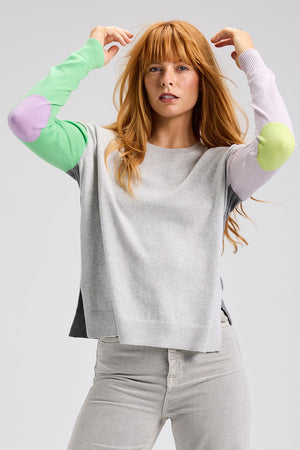 Zaket & Plover Elbow Intarsia Sweater in Marl.  Marled gray front, light purple leftsleeve, light green right sleeve medium gray heathered back.  Contrast color intarsia elbow patches.  Crew neck long sleeve sweater.  Rib trim at neck, hem and cuff.  Side slits.  Relaxed fit._61200483549550