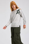 Zaket & Plover Threaded Star Sweater in Marled gray.  Boatneck dolman long sleeve knit.  2 intarsia and embroidered stars on front.  Contrast color threaded double rows of stitching down each sleeve.  Plain back.  Rib trim at neck and cuff.  Side slits.  Relaxed fit._t_61395591037294