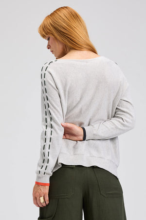 Zaket & Plover Threaded Star Sweater in Marled gray.  Boatneck dolman long sleeve knit.  2 intarsia and embroidered stars on front.  Contrast color threaded double rows of stitching down each sleeve.  Plain back.  Rib trim at neck and cuff.  Side slits.  Relaxed fit._61395591070062