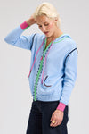 Zaket & Plover Threaded Hoodie in Sky.  Zip front hoodie with green contrast zipper placket and hoodie trim.  Blue handstitching  next to zipper placket.  Contrast color ribbed cuffs .  2 front patch pocket with rainbow striped trim.  Rib hem.  Striped trim at armhole.  Relaxed fit._t_61025110098286