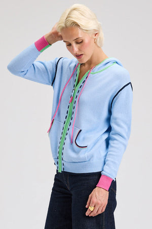 Zaket & Plover Threaded Hoodie in Sky.  Zip front hoodie with green contrast zipper placket and hoodie trim.  Blue handstitching  next to zipper placket.  Contrast color ribbed cuffs .  2 front patch pocket with rainbow striped trim.  Rib hem.  Striped trim at armhole.  Relaxed fit._61025110098286