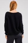 Zaket & Plover Intarsia Heart Sweater in Black.  Boat neck long sleeved. sweater with multi-color, multi-sized intarsia hearts on front and sleeves.  Plain back.  Rib trim at cuff and hem.  Contrast color trim at cuff.  Side slits. Relaxed fit._t_61457766973806