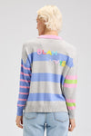 Zaket & Plover Blah Blah Rugby Sweater in Marled.  Marled gray and periwinkle stripes front and back.  Color blocked contrast stripe sleeves.  Pink polo collar with 3 button placket.  Long sleeves.  Dropped shoulders.  Stitched "Blah Blah" slogan on back.  Rib trim at cuff and hem.  Relaxed fit._t_61200746217838