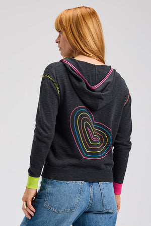 Zaket & Plover Heart Embroidered Hoodie in Charcoal.  Zip front with attached hood.  Contrast color striping on each size of placket and around hood.  Contrast drawstrings.  Long sleeve with color block cuffs. 2 front pouch pockets. Blanket stitch detail at armhole and pocket trim.  Rib trim at cuff and hem.  Embroidered concentric hearts in multi colors on back.  Relaxed fit._61399583850862