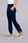 Sympli Quest Pant in Navy. Dropped waist pull on pant with slash pocket. Buttons at lower outside leg. Convertible length. Relaxed fit._t_34343100973256