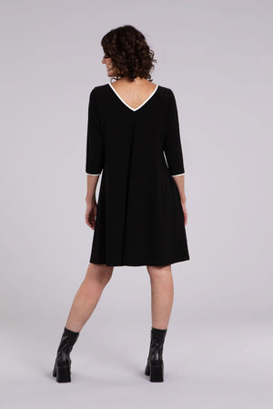 Sympli Tipped Reversible Trapeze Dress in Black. V neck or crew neck front or back? It's your choice! A line relaxed fit dress with 3/4 sleeves. Ivory contrast color tipping at neckline and cuff. In seam pockets._34438205931720