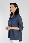 Cali Girls Boxy Half and Half Blouse in Navy/Black stripes. Convertible collar button down with 3/4 sleeve and split cuff. Subtle tone on tone print. Blouse is split in half at waist with print running bi-directionally. High low hem. Side slits.Relaxed fit._t_34092496355528