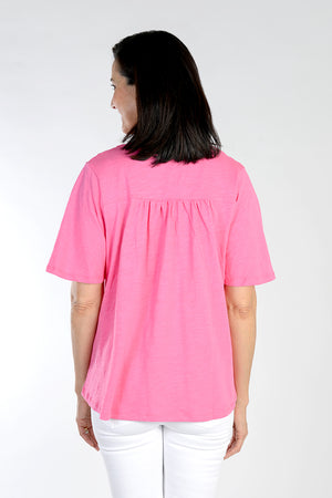 Top Ligne Embroidered Detail Tee in Hot Pink. V neck top with embroidery insets on v placket. Short flutter sleeve. Back gathered yoke. Straight hem. A line shape. Relaxed fit._34111175622856