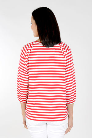 Top Ligne Striped Raglan Balloon Sleeve Top in Red and White stripes. Banded crew neck with raglan balloon sleeves. Elastic cuffs. Reverse raw raglan seams. Relaxed fit._34038551937224
