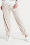 Planet Pinched Pleat Pant in Putty. Elastic waist pull on pant with draped lantern style leg with pinched pleats to cinch at hem. 2 Side seam pockets. Relaxed fit._t_34035368952008