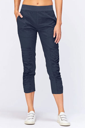 Wearables Geyser Crop Pant in Navy. Pull on pant with ruched jersey insets. 10" rise. 24 1/2" inseam. 2 front pockets_33926725599432