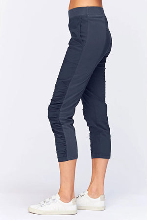 Wearables Geyser Crop Pant in Navy. Pull on pant with ruched jersey insets. 10" rise. 24 1/2" inseam. 2 front pockets_33926725959880