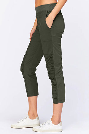 Wearables Geyser Crop Pant in Olive. Pull on pant with ruched jersey insets. 10" rise. 24 1/2" inseam. 2 front pockets_33926743589064