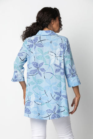 Habitat Travel Princess Seamed Shirt in Sky. Stylized block print flowers in shades of blue green and white on a sky blue background. Pointed collar button down shirt. Contour seaming front and back. 3/4 sleeve with split cuff and button trim. Inverted "U" hem in front; curved in back. High low hem. Relaxed fit._34133763227848