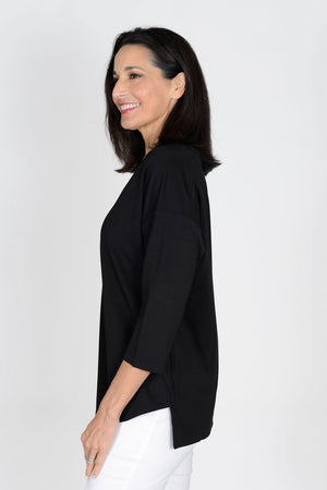 Lolo Luxe V neck High Low Solid Top in Black. V neck relaxed fit top with center seam. High low hem. Curved hem in front; straight in back._33829295489224