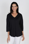 Lolo Luxe V neck High Low Solid Top in Black. V neck relaxed fit top with center seam. High low hem. Curved hem in front; straight in back._t_33829295456456