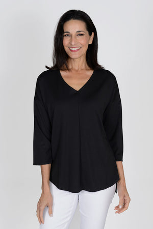 Lolo Luxe V neck High Low Solid Top in Black. V neck relaxed fit top with center seam. High low hem. Curved hem in front; straight in back._33829295456456