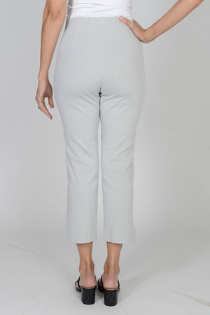 Holland Ave Susan Denim Crop Pant in Pearl gray. Pull on hidden waistband pant with faux zipper flap. Snug through hip falls straight to hem. Side slits. 25" inseam._34070712189128