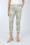 Organic Rags Spots Pant. Stylized animal print in Khaki on a white and beige background. Elastic waist pull on pant with metallic drawstring. 2 front slash pockets. Stretch crinkle fabric. Back pointed yoke detail. Convertible hem. Inseam: 27 1/2"_t_34011794342088