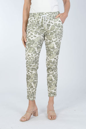 Organic Rags Spots Pant. Stylized animal print in Khaki on a white and beige background. Elastic waist pull on pant with metallic drawstring. 2 front slash pockets. Stretch crinkle fabric. Back pointed yoke detail. Convertible hem. Inseam: 27 1/2"_34011794342088