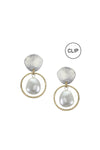Stylish and modern dangle earrings each featuring a luminous white pearl framed by a golden brass ring hanging from a hammer textured organic shaped silver stud with a  standard hypoallergenic earring clip backing._t_33891613278408