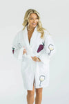 Unwind with the luxurious On Cloud Wine Terry Robe! Made from 100% cotton, this plush bathrobe is decorated in whimsical vino inspired illustrations and features two front patch pockets, a turned back shawl collar, and an adjustable self wrap belt for maximum comfort. _t_33553063805128