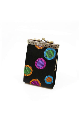 The Dot Card Holder is a stylish secure wallet with a lovely brocade fabric exterior, accordion-style pleated slots with RFID protection, and a golden metal snap clasp for easy access. Keep your money tucked away pretty and safely with this gorgeous travel friendly wallet! _33592046584008