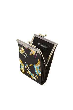 The Butterfly Card Holder is a stylish secure wallet with a lovely brocade fabric exterior, accordion-style pleated slots with RFID protection, and a golden metal snap clasp for easy access. Keep your money tucked away pretty and safely with this gorgeous travel friendly wallet! _34716061597896