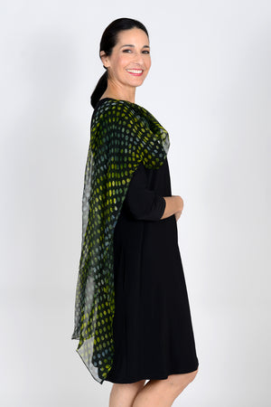 Add style and grace to your outfit with all-day comfort and appeal! The Oliver Dots Scarf is handmade in the batik tie-dye technique featuring a wave of colorful varied dots on a semi-transparent black background. _33816041849032
