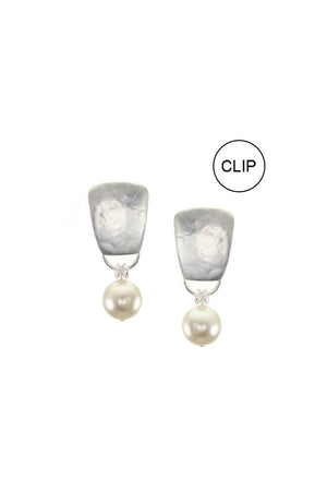 The Pearl Taper Clip-On Earrings feature a luminous cream colored Austrian crystal pearl dangling from a silver colored, tapered rounded rectangle with standard clip on backing._33122121973960