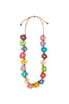 The Aruba Necklace is a bold and stylish eco-friendly long necklace featuring uniquely shaped hand-carved beads made from thinly sliced tagua nuts accented by recycled coconut spacer discs linked together on an adjustable tan wax cotton cord. _t_34112620167368