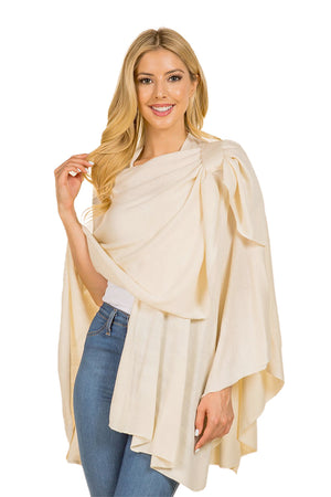 This versatile wrap has a flattering fit, and can be worn as a shawl or wrapped around you you attaching the end to the top loop creating an elegant draped look. Perfect for evenings out or chilly afternoons. The Pull Thru Wrap is a wardrobe must-have! _33926489735368