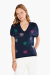 This sustainable sweater features a fun and bright design that pops against the deep indigo background, a flattering v-neck, and roomy short sleeves. The NIC+ZOE Color Spun Sweater is just as comfy as it is eye-catching!_t_34057381380296