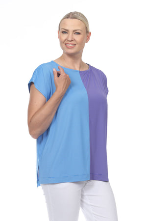 Terra Cap Sleeve Duo Top. Crew neck cap sleeve tee in Blue/Ocean. Top is split down the middle front and back and color-blocked in 2 complementary shades. Side slits. High low hem. Relaxed fit._33977935626440
